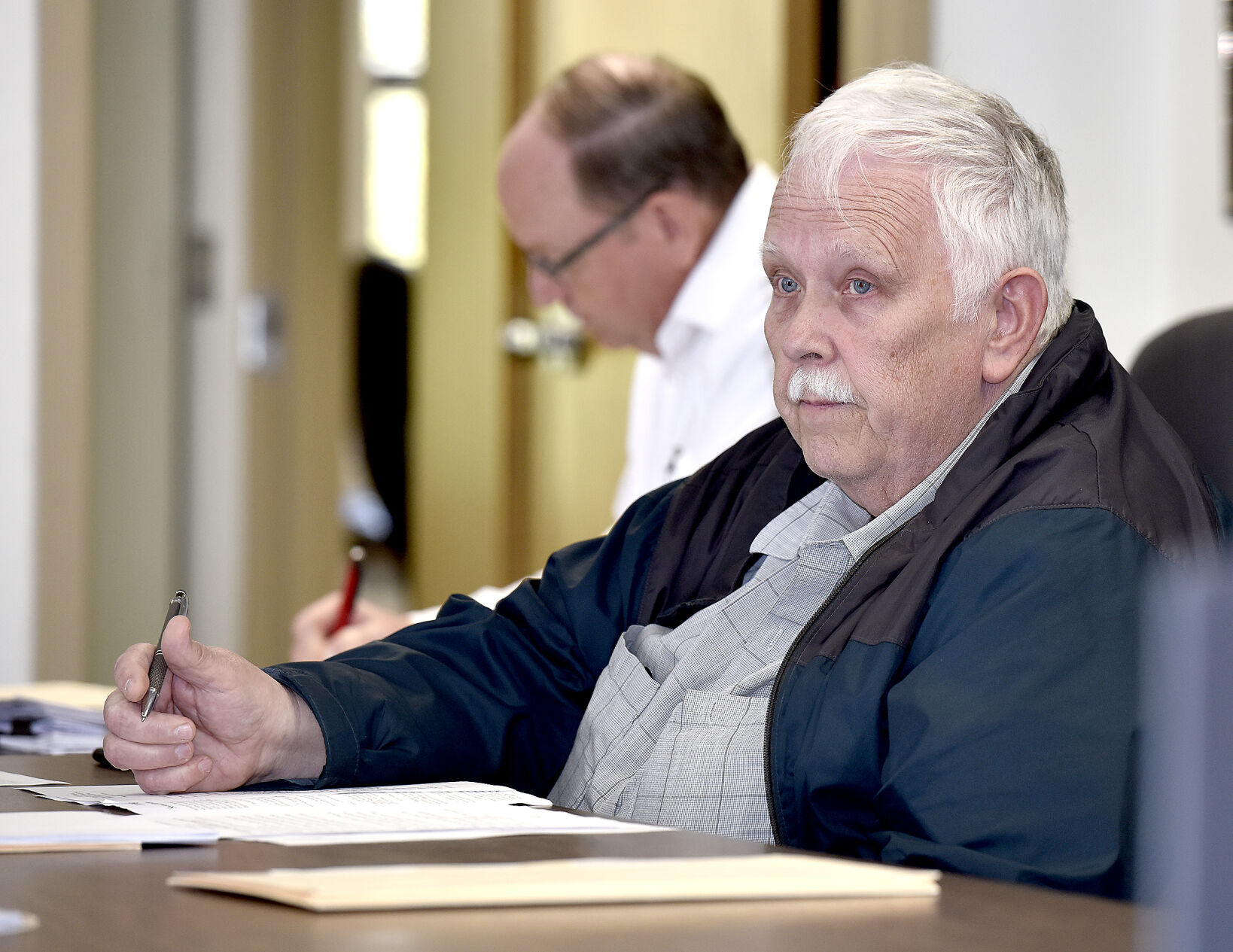 County board considers resolution, passes ordinance